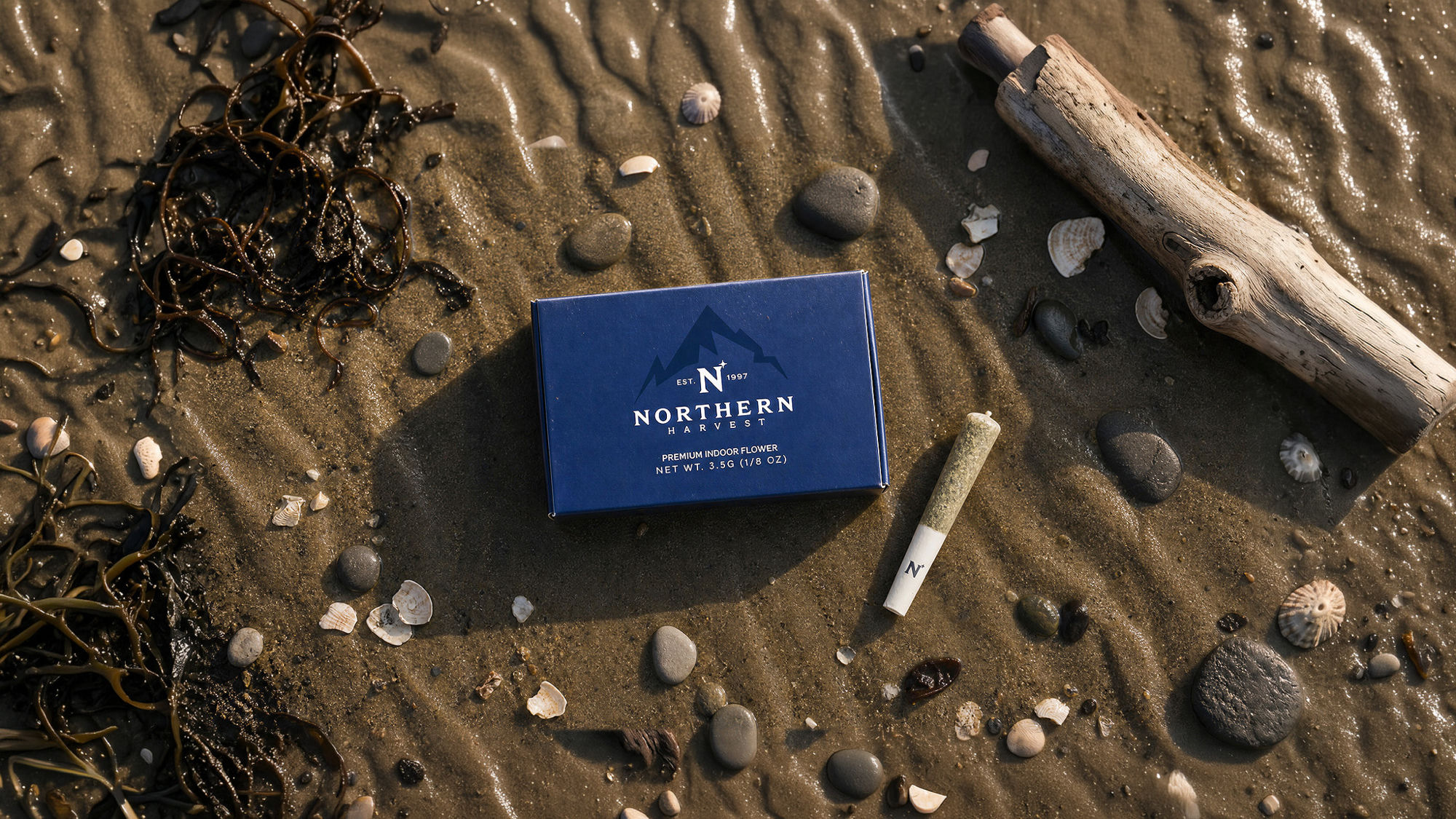 Northern Harvest premium indoor flower box and pre-roll on a Humboldt, California beach
